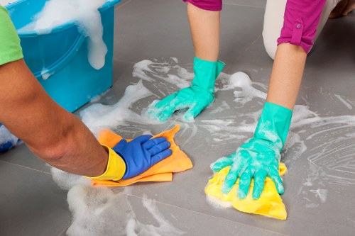 Cleaning professional inspecting a surface as part of a safety check