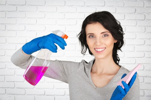 Cleaner restoring a sofa in a Pimlico home with safe methods